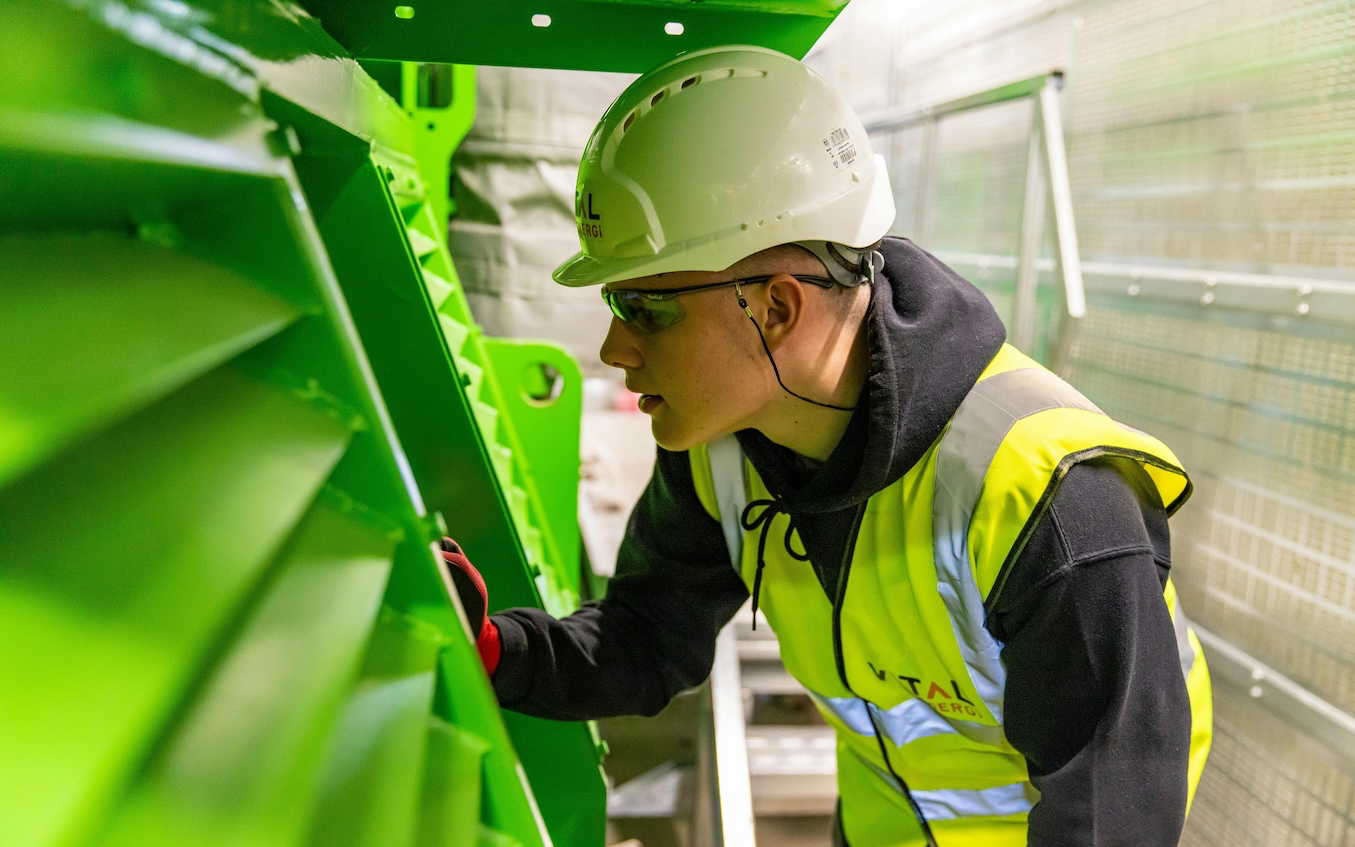 man in hard hat starting at something