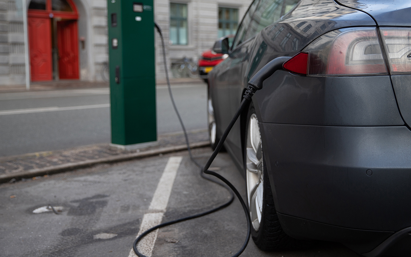 Electric vehicle being charged